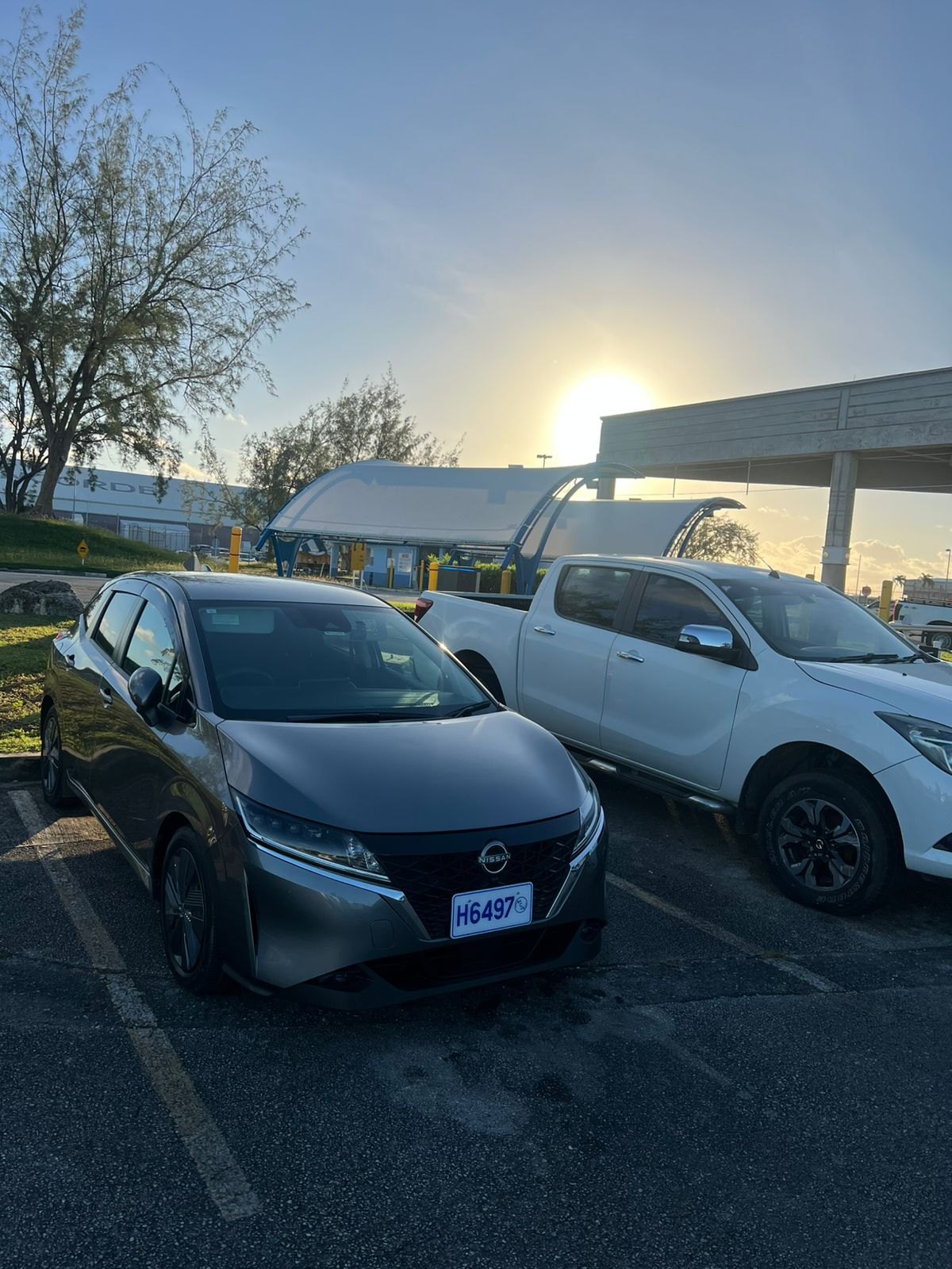 Z.H. Rentals dark-grey Nissan Note at Grantley Adams International Airport in Barbados